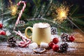 Mug with hot chocolate snow wooden table