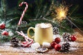 Mug with hot chocolate snow wooden table