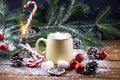 Mug with hot chocolate snow wooden table