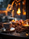 A mug of hot cocoa with marshmallows and spices is on a wooden table with candles.