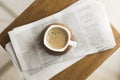 Mug with hot coffee newspapers . High quality and resolution beautiful photo concept