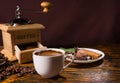 Mug of hot drink besides chocolate dessert Royalty Free Stock Photo
