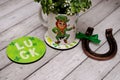 A mug with the image of a leprechaun and a quatrefoil, a horseshoe for happiness and good luck. St.Patrick \'s Day.