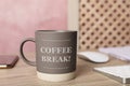 Mug with inscription Coffee Break on wooden table Royalty Free Stock Photo