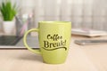 Mug with inscription Coffee Break on wooden table in office Royalty Free Stock Photo