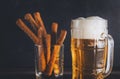 Mug of light beer with croutons on a black background, alcoholic drink Royalty Free Stock Photo