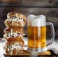 A mug of light beer and a huge burger Royalty Free Stock Photo