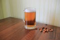 Mug of light foam beer with croutons