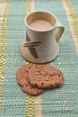 A mug of milk coffee on the table with chocolate chip cookies Royalty Free Stock Photo