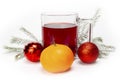 Mug with mulled wine on a background of a Christmas tree branch with snow Royalty Free Stock Photo