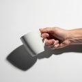The mug is positioned sideways, and its shadow is visible on the surface Royalty Free Stock Photo