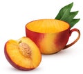 Mug of ripe peach fruit one cut in half with bone with leaf Royalty Free Stock Photo