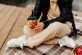 mug with a straw in the hands of a girl autumn picnic Royalty Free Stock Photo