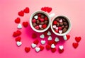 Mug with sugar and chocolate hearts on pink background. Flat lay composition. Romantic, St Valentines Day concept