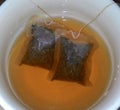 Mug of tea with two tea bag isolated