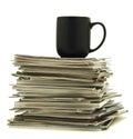 Mug on top of magazine stack