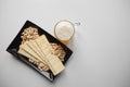 Mug of unfiltered light wheat beer with beer snacks on white table Royalty Free Stock Photo