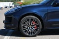 Mugello Circuit, Italy 23 September 2022: Detail of alloy black wheel with red caliper of a Porsche Cayenne Turbo on display in th