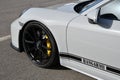 Mugello Circuit, Italy - 23 September 2021: detail of an alloy wheel rim with yellow brake caliper of a Porsche 911 in the paddock Royalty Free Stock Photo