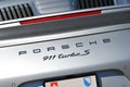 Mugello Circuit, Italy - September 23, 2022: Detail of Porsche emblem on the rear of a Porsche 911 Turbo S in the Paddock of the M