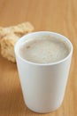 A mugg of coffee with a rusks in the background Royalty Free Stock Photo