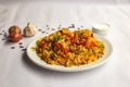 Mughlai Chicken tikka Biryani rice pulao with garlic, onion and raita served in plate isolated on background side view of indian Royalty Free Stock Photo