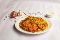 Mughlai Paneer tikka Biryani rice pulao with garlic, onion and raita served in plate isolated on background side view of indian