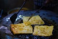 Mughlai paratha, an indian street fast food is being fried in oil in a frying pan Royalty Free Stock Photo