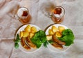 Mugs of beer with plates of grilled sausages. Top view Royalty Free Stock Photo