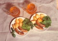 Mugs of beer with plates of grilled sausages. Top view. Royalty Free Stock Photo