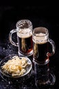 Mugs with beer on table Royalty Free Stock Photo