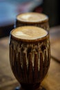 A close up of two decorative mugs of coffee, with a shallow depth of field Royalty Free Stock Photo