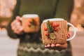 Mugs of hot tea in knitted vintage cup Royalty Free Stock Photo