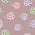 Mugs seamless pattern. Mugs decorated with polka dots, flowers and hearts.