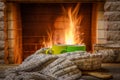 A mugs of tea and woolen thing near a cozy fireplace, in a country house, winter or autumn holidays