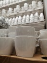 Mugs white set sale in the store. cups utensils for the kitchen