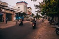 MUI NE, VIETNAM - CIRCA MARCH 2017: Many Asians ride motorbikes on the road in the evening Royalty Free Stock Photo