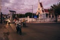 MUI NE, VIETNAM - CIRCA MARCH 2017: Many Asians ride motorbikes on the road in the evening Royalty Free Stock Photo