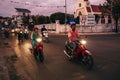 MUI NE, VIETNAM - CIRCA MARCH 2017: Many Asians ride motorbikes on the road in the evening Royalty Free Stock Photo