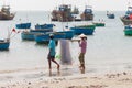 Vietnamese fishermen couple with nets
