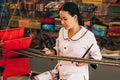 MUI NE, VIETNAM - MARCH 6, 2017: Woman Asian weaver working on a traditional loom for yarn silk Royalty Free Stock Photo