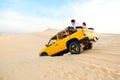 Mui Ne, Vietnam - May 1, 2018 : Off road car vehicle in white sand dune desert at Mui Ne