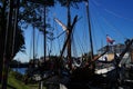 Sail boats stands moored near the river promenade of Muiden