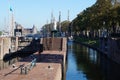 Sail boats stands moored near the river promenade of Muiden