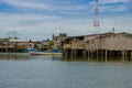 Muisne, Ecuador - March 16, 2016: Muisne waterfront homes as seen from water, modest concrete houses sitting on poles