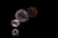 Muiticolored rays of fireworks shine overshadow the stars