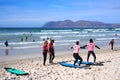 MUIZENBERG BEACH, CAPE TOWN, SOUTH AFRICA - 9 March 2018 : Muizenberg beach is a common morning surf spot for Capetonians. Royalty Free Stock Photo