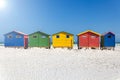 Muizenberg beach with white sand and colorful wooden cabins in Cape Town
