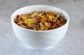 Mujadara: lentils, rice and fried onions on a light concrete background close-up