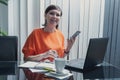 Smiling and happy business woman working with her mobile phone and laptop in the office. Success business, People smiling working Royalty Free Stock Photo